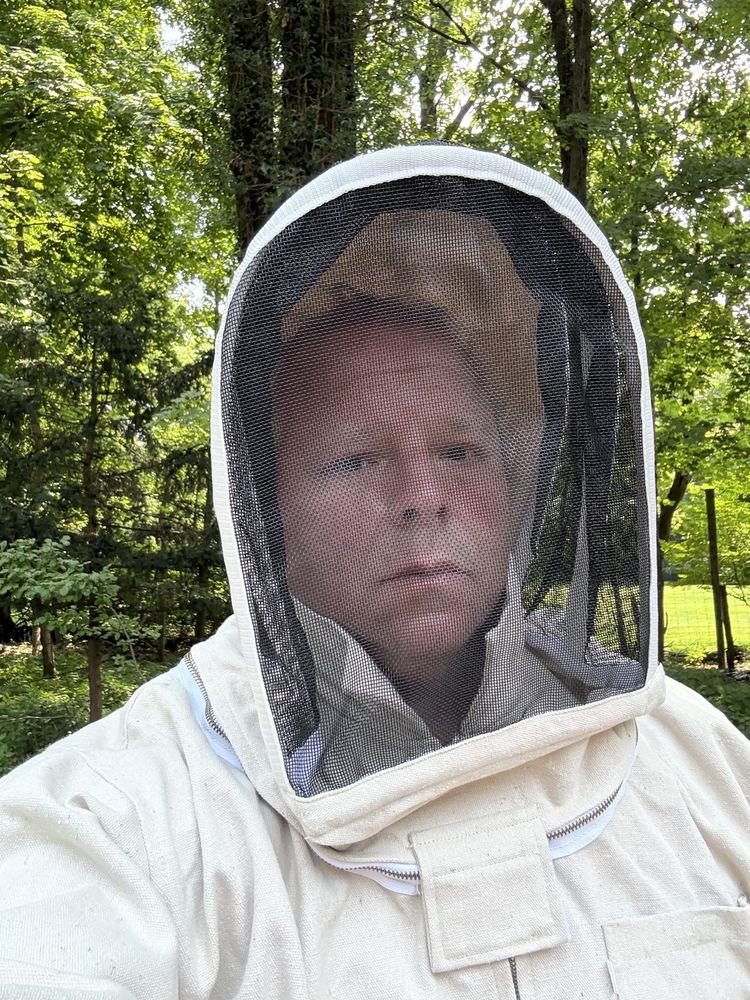 Protective bee suit on before a nest removal